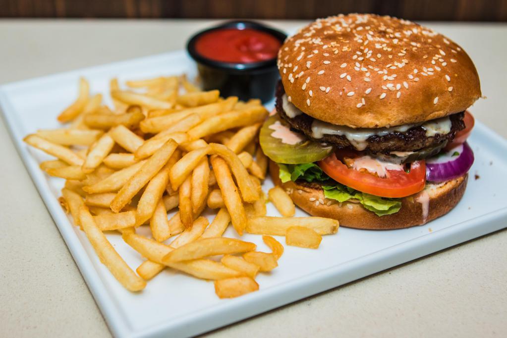 Cheeseburger · Fresh and juicy beef, lettuce, tomato, red onion, pickles, and panini sauce, topped with cheese. Served with choice of french fries or house salad.