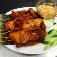 Satay Chicken (6) · Chicken skewers seasoned with a hint of turmeric and lemongrass served with traditional pean...