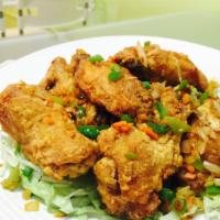 Salt and Pepper Wings (8) · Hand battered wings tossed with bell pepper ,onions,carrots and spices to fragrant