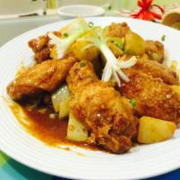 Curry Wings (8) · Crispy wings sauteed with traditional curry sauce with potatoes and onions