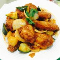 Tom Yam Wings (8) · Golden brown wings stir fried with cucumber ,onion and pineapple in tom yam sauce