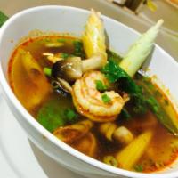 Shrimp Tom Yam Soup · Shrimp, baby corn, straw mushrooms, pea pods and lemongrass prepared in a piping hot and spi...