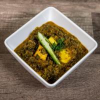 Palak Paneer · Homemade cottage cheese cooked with spinach and Indian spices. Served with rice.
