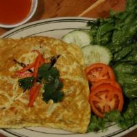 42. Thai Omelette · Fried ground pork with tomatoes, bell peppers and onion wrapped with egg sheet.