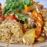 80. Pineapple Fried Rice · Stir fried steamed rice with pineapple, egg, onion, curry powder, cashew nut, raisin and bel...