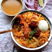 Hyderabadi Chicken Dum Biryani · Hyderabadi Dum style Biryani cooked with basmati rice and choice of veggies or chicken. Serv...