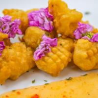Calamari · Deep-fried calamari in crunchy light batter, served with spicy mayo and spicy sweet and sour...