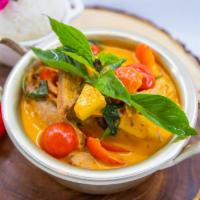 Duck Thai Red Curry · Boneless duck with Thai red curry, coconut milk, pineapple, tomatoes, chili and basil leaves...