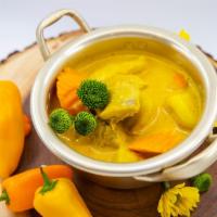 Yellow Curry Chicken · Yellow curry with dark chicken, potato, carrot and coconut milk. Medium spice.
