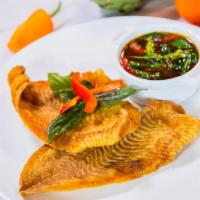Filet Flounder · Topped with a spicy chili sauce and basil leaves. Mild spice.