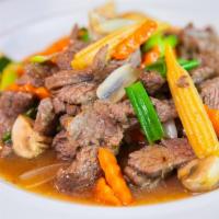 Beef with Oyster Sauce · Stir-fried beef with oyster sauce, mushrooms, carrots, onions and green peppers.