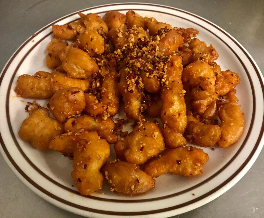 Spicy Salt and Pepper Chicken · Deep fried chicken tossed with coarse salt and pepper blend along with Chinese chillis. Spicy.