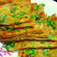 9. Muglai Paratha · Multi-layered flour bread stuffed with ground meat, eggs, onions and herbs.