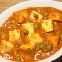 21. Matar Paneer · Homemade cheese fried and cooked with fresh green peas.