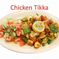 28. Chicken Tikka · Diced chicken marinated in yogurt, herbs and spices grilled in tandoor oven.