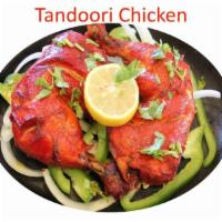 29. Tandoori Chicken · Chicken leg marinated in yogurt, herbs and spices then grilled in tandoor oven.