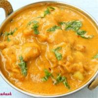 36. Chicken Curry · Chicken cooked with blend of onions, tomatoes and mild spices.