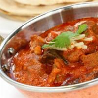 48. Goat Rogonjosh · Succulent pieces of goat cooked with herbs spices and lots of fresh tomatoes.