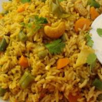 62. Vegetable Biryani · Assorted vegetables cooked with basmati rice with saffron herbs and spice.