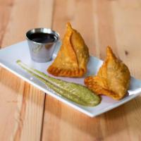 2. Vegetable Samosa (2 Pieces) · Pastries filled with potatoes, peas and herbs. ( 2 Pieces)