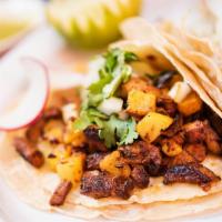Al Pastor Taco (3 Pieces) · Marinated pork with grilled pineapple and onions. Tacos topped with fresh onions and cilantr...