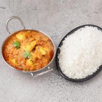 Chicken Curry · Chicken cooked with tomato and fresh onion with herb spices.