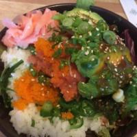 393167. Spicy Tuna Don Rice Bowls · Spicy tuna, avocado slice, masago, seaweed over sushi rice with sesame sauce.