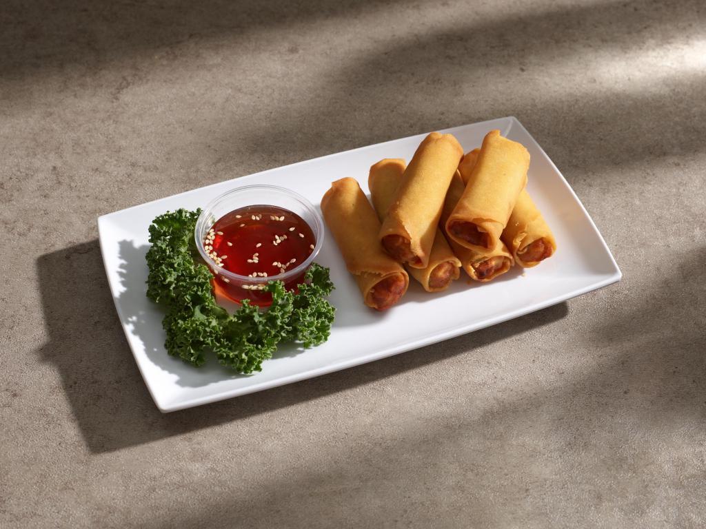 A6.Spring Rolls · 6 pieces deep fried spring rolls stuffed with cabbage, carrot, mung bean noodles, and shiitake mushroom, served with sweet chili sauce. Vegan.