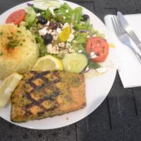 Grilled Salmon Platter · Char-grilled wild salmon with Mediterranean spices. Served with basmati rice, Greek salad, w...