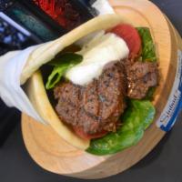 Shish Kabob Wrap · Lean cuts of marinated beef charbroiled to perfection. Served on warm pita bread with lettuc...