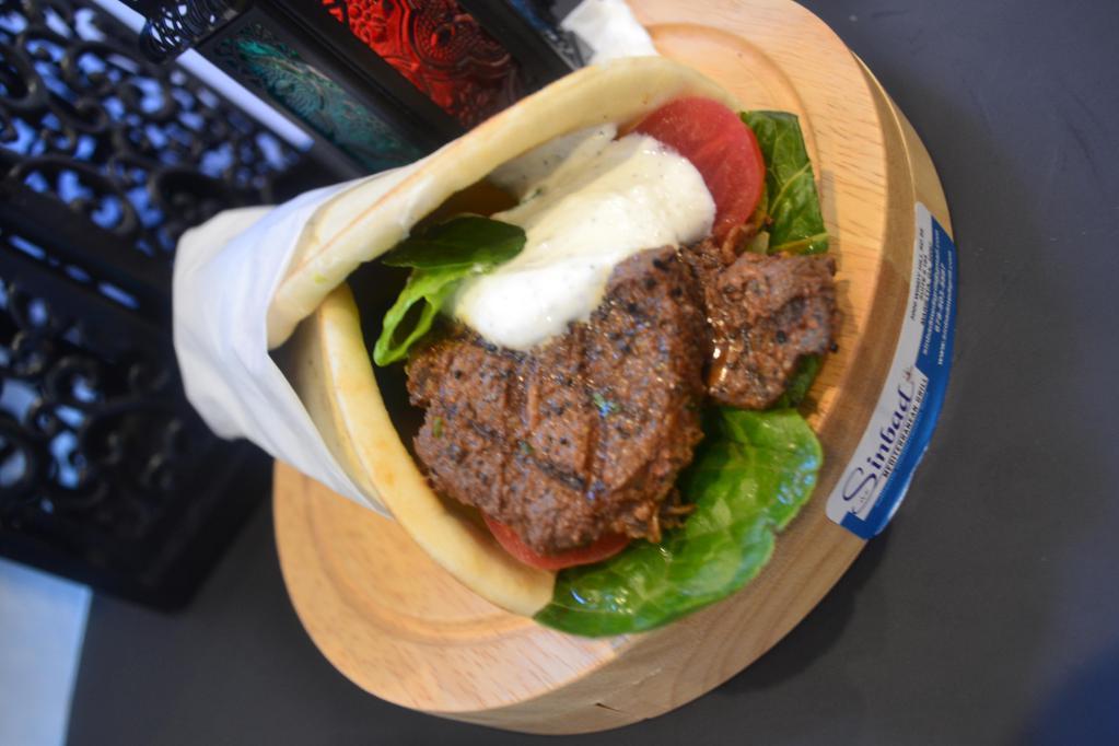 Shish Kabob Wrap · Lean cuts of marinated beef charbroiled to perfection. Served on warm pita bread with lettuce, tomatoes and choice of sauce.