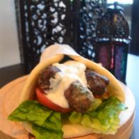 Kufta Kabob Wrap · Charbroiled ground sirloin beef, seasoned with a special blend of herbs and spices. Served o...