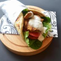 Chicken Kabob Wrap · Tender marinated chicken breast charbroiled to perfection. Served on warm pita bread with le...