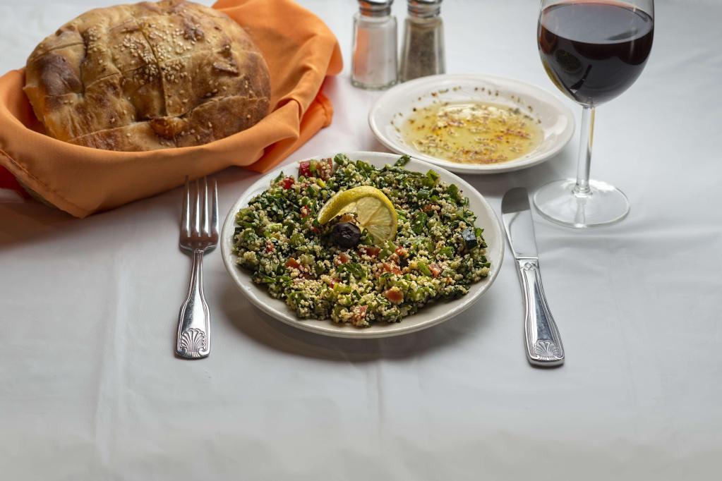 14. Kisir ( tabouli ) ( Kosher ) · Tabouli. A mixture of cracked wheat, green onions, red sweet pepper, tomatoes and parsley.