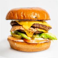 Texana Burger · Double meat, ham, cheese, avocado, jalapenos, lettuce, tomato, mayo and fries.