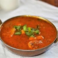 Shrimp Curry · A traditional Indian dish carefully seasoned with an exotic blend of curry spices, onion, ga...