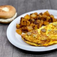 Meat 'N Cheese Omelette · Applewood Smoked Bacon, Sliced Sausage and American Cheese added to Fluffy Eggs.