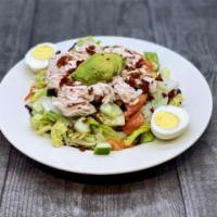 One-Of-A-Kind Cobb Salad · Assorted Chilled Greens topped with Fresh Turkey, Bacon Bits, Avocado, chopped Tomatoes, Har...