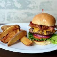 Big Bacon Burger · 1/2 lb Burger topped with Applewood Smoked Bacon and Melted Cheddar Cheese on a Grilled Kais...