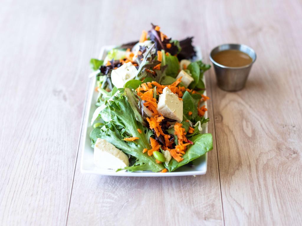 Asian Tofu Salad · Organic mixed greens, organic tofu, edamame, carrots, cabbage and wonton strips with miso sesame vinaigrette served on the side. Served with sourdough bread. Vegetarian and dairy-free.