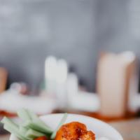 Cauliflower Buffalo Wings · Served with a house-made ranch dipping sauce & celery sticks.