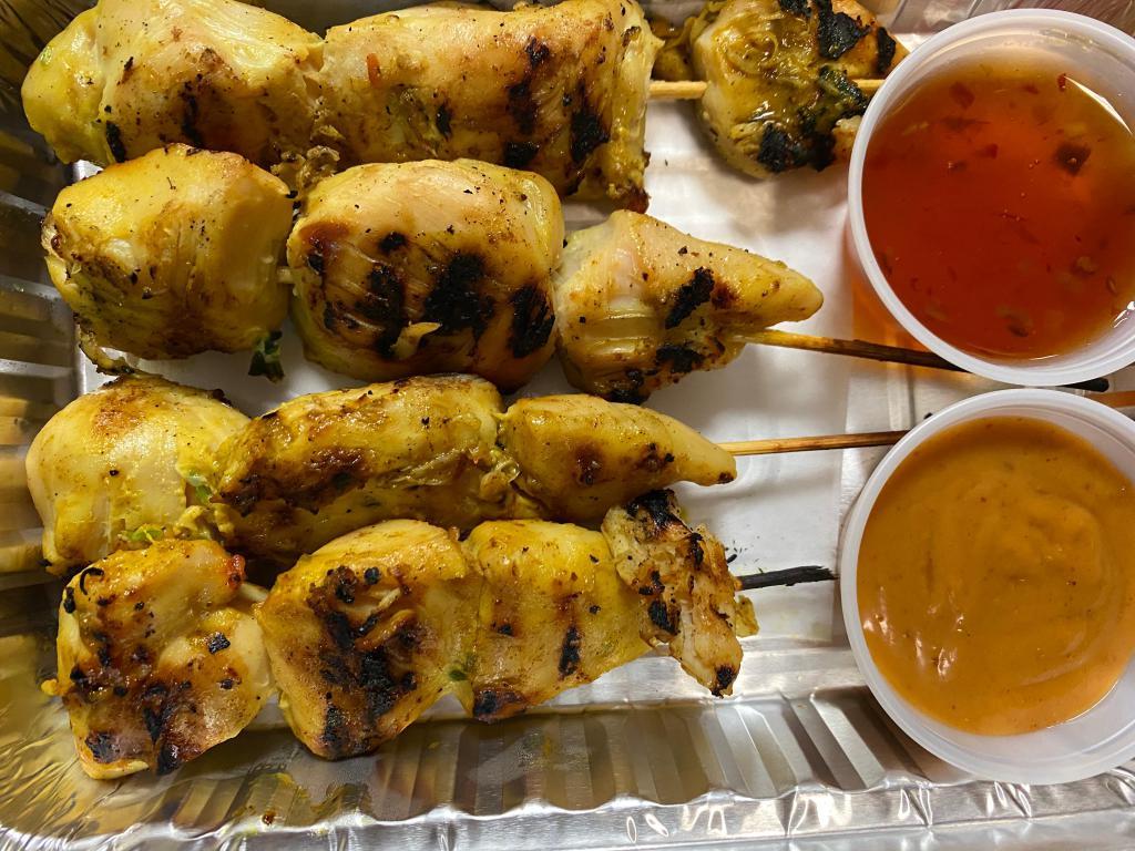 A1. Satay Appetizer · 4 pieces. Chicken or beef marinated with herbs and coconut milk then grilled and served with peanut sauce and sweet and sour sauce.
