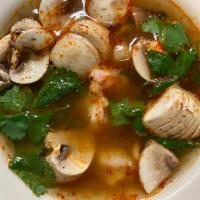 S1. Tom Yum Soup · Famous Thai hot and sour soup, served with chicken, spiced with chili, lemongrass, mushrooms...