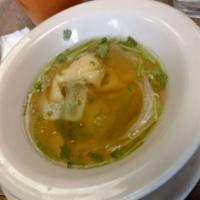 S5. Wonton Soup · Thai style wonton soup in clear chicken broth with lettuce and chopped parsley and scallions.