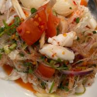 SL7. Yum Seafood · Thai spicy salad in lime juice with shrimp, squid, scallops, mussels, jelly noodles and cila...