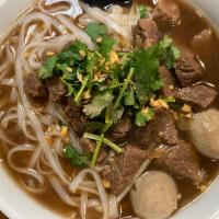 NS4 Beef Stew Noodle Soup · Beef stew, beef balls and bean sprouts in Thai herb soup on top with cilantro