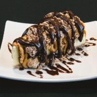 Reese's Peanut Butter Cup Cheesecake · Topped with Reese's Peanut Butter Cups, Reese's peanut butter and hot fudge.