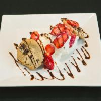 Cookie Sundae · Two warm cookies, two scoops of your choice of ice cream, two toppings and whipped cream.