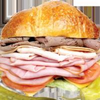 #68. Lee's Club Baguette Sandwich · Roast beef, turkey and ham.