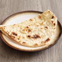 Butter Naan · Traditional Indian bread, cooked in tandoor (clay oven). (brushed with butter on top).